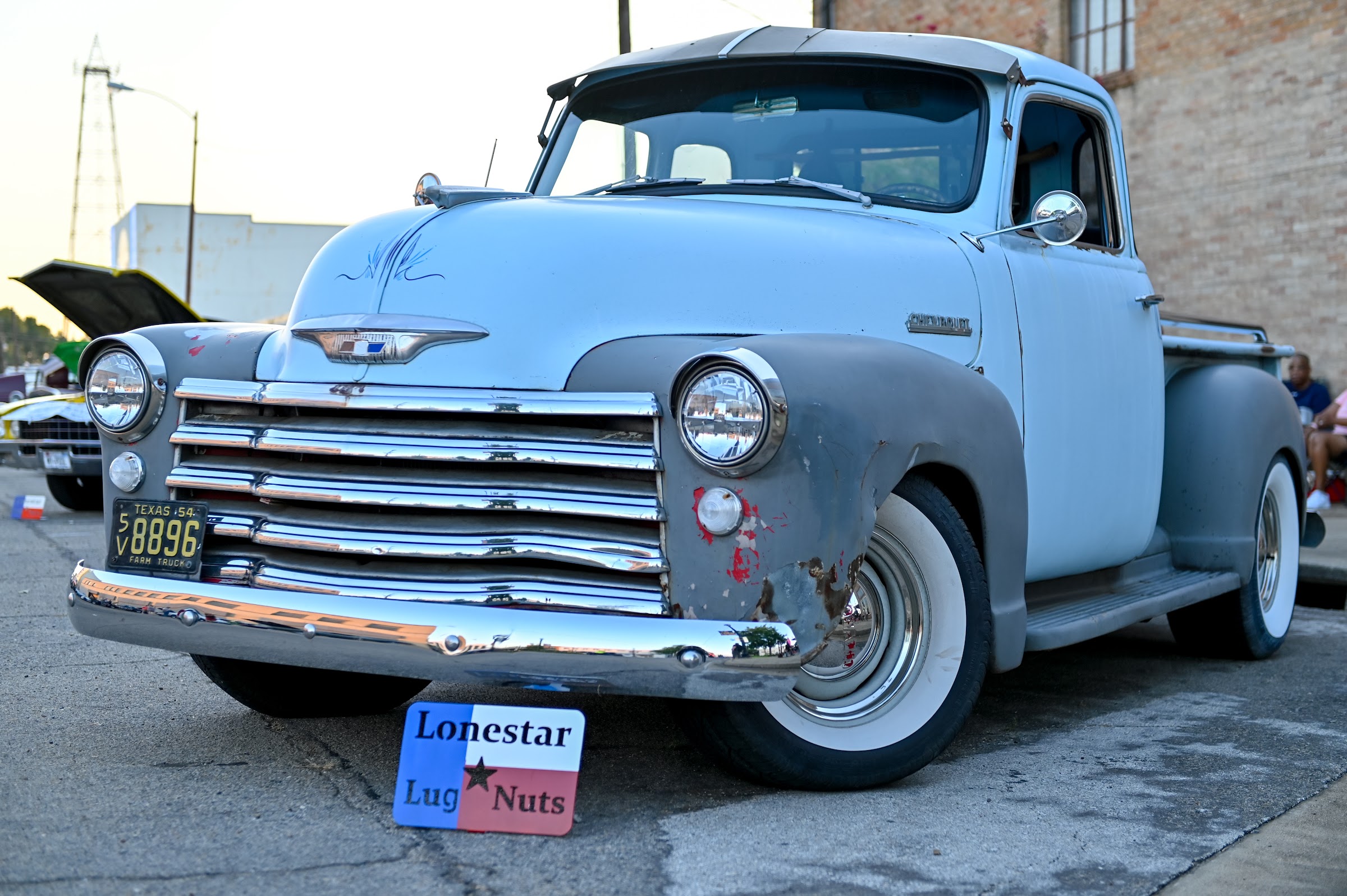 Classic cars lined along a downtown street during an evening cruise night — car photography in East Texas by Kaden Baker
